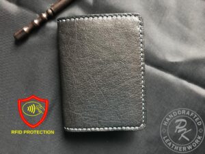 Cora RFID protected wallet in Black with Blue stitching